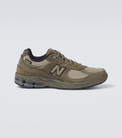 designer di moda New Balance Scarpe 2002R con bordo in pelle scamosciata di colore verde